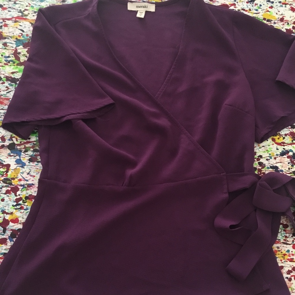 Purple blouse ties on the side